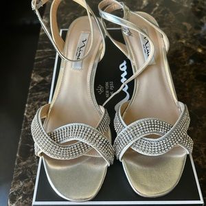 Nina silver strappy sandals, with low wedge heel. Size 9, new w/tags.